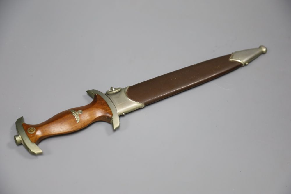 A German WW2 Third Reich SA dagger, by C. G. Haenel, Suhl, the 22cm blade, inscribed Alles Fur Deutschland with brown nickel mounted